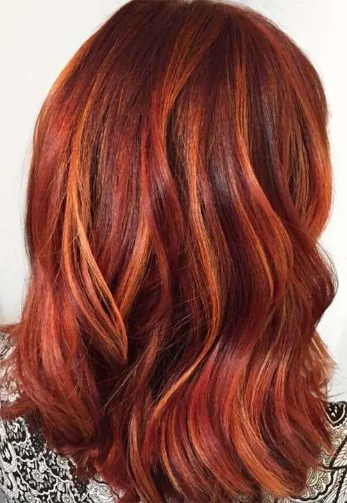 dark brown hair with red highlights with orange