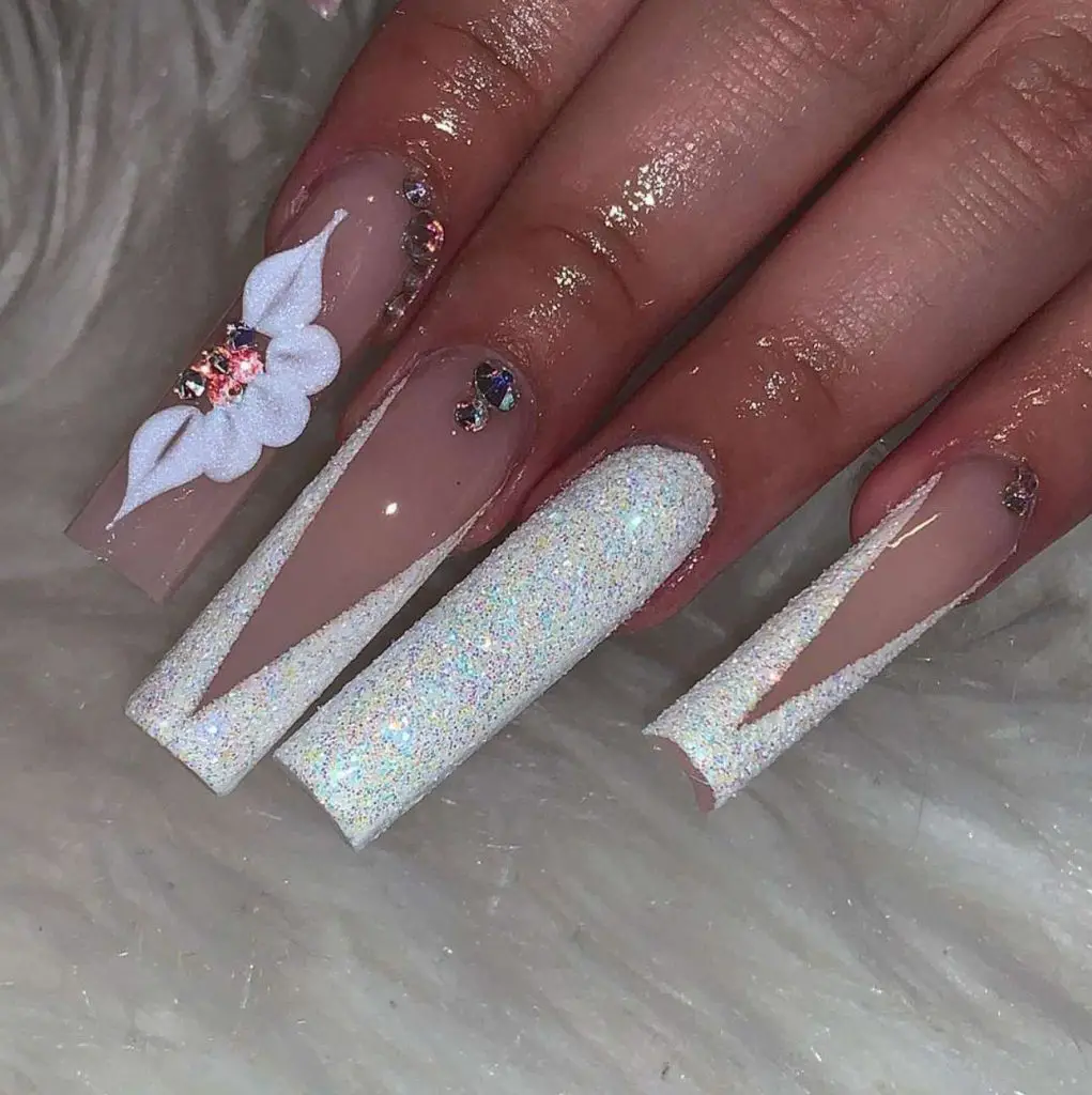 Glittery Nude Pink And White Nails With Rhinestones