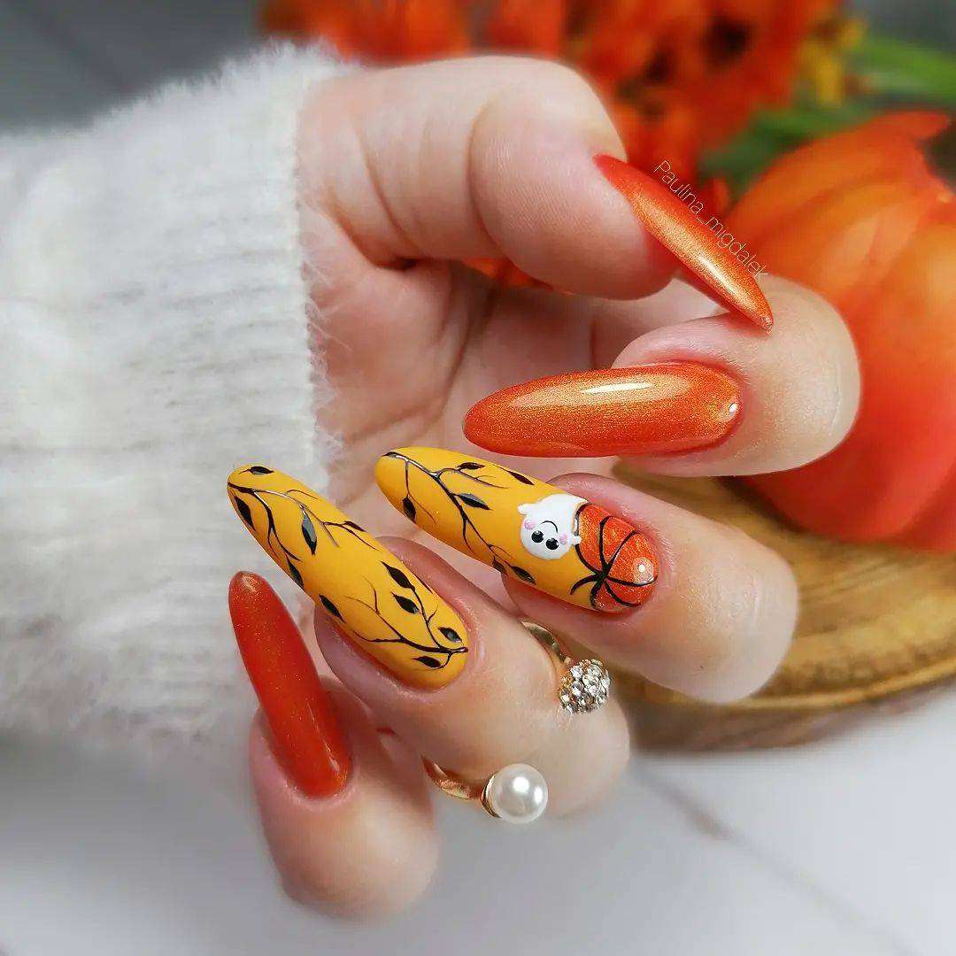 Long Orange And Black Almond Nails With Pumpkins