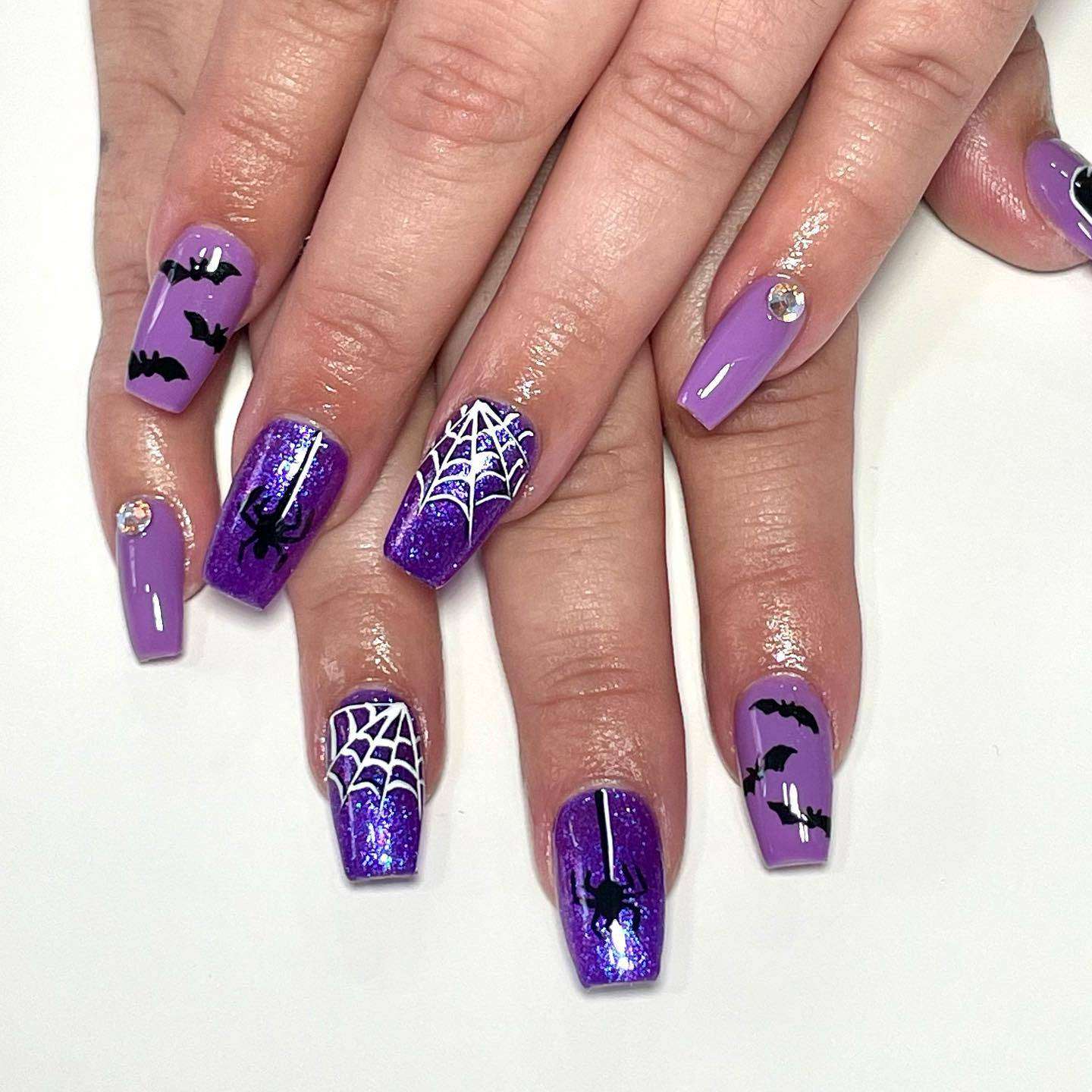 Glittery Purple And Black Halloween Nails