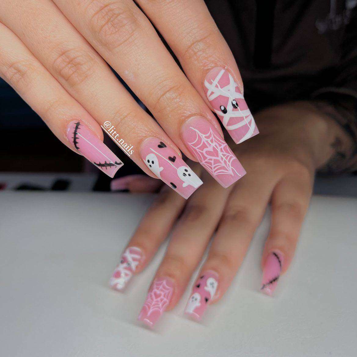 Cute Pink Halloween Nails With Black And White Nail Art