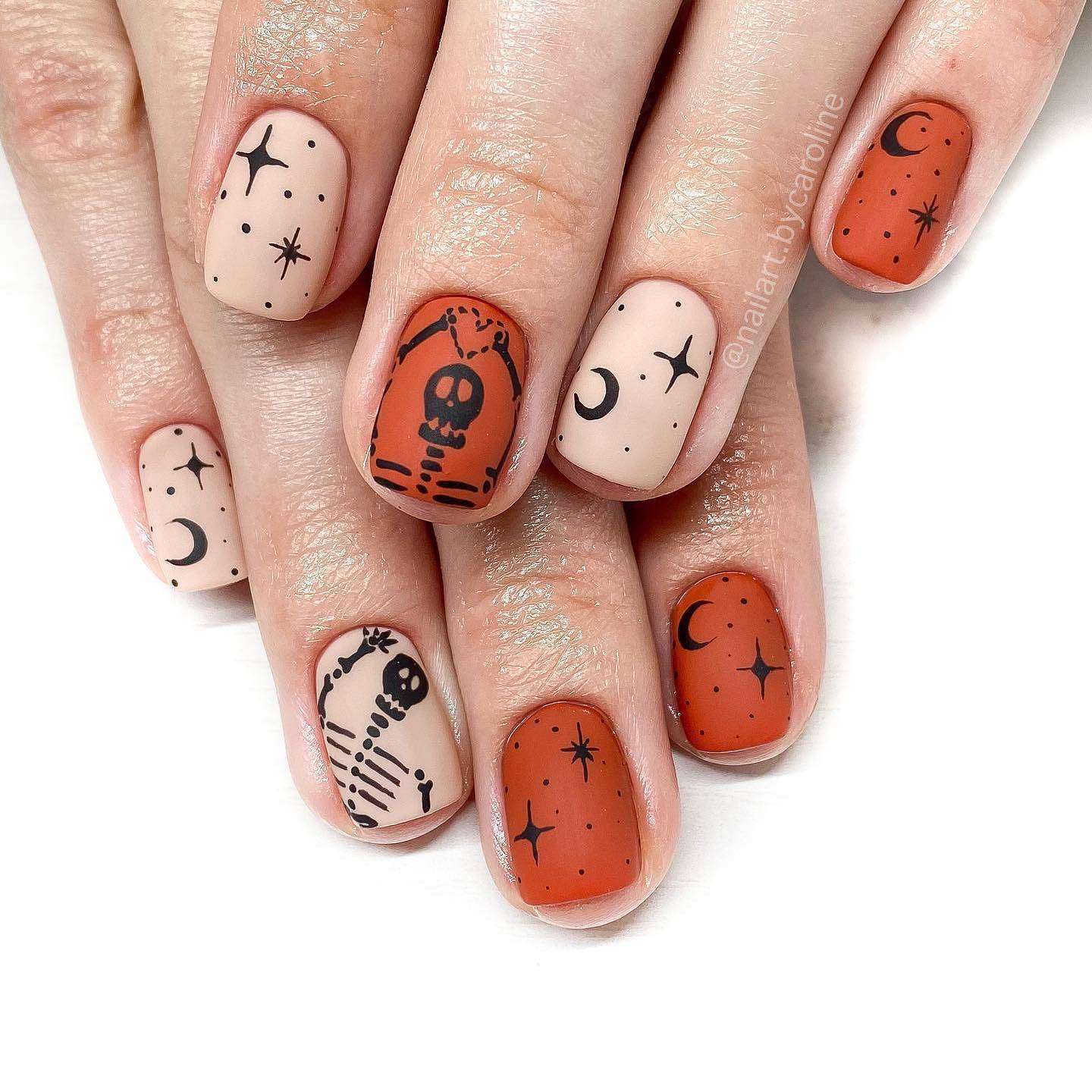 Nude And Orange Skeleton Nails With Black Nail Art