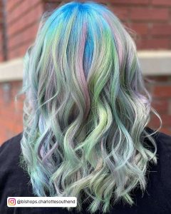 Opal Colored Hair With Pastel Green And Pastel Blue Highlights On Platinum Silver Hair With Blue Roots