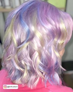 Light Blue And Light Purple Highlights In Platinum Blonde Hair