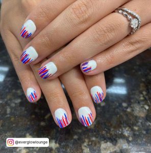 Short White Nails With Red And Blue Stripes