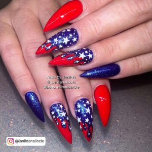 Red And Navy Stiletto Nails With White Star Designs