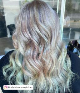 Long And Wavy Platinum Blonde Hair With Pastel Pink And Pastel Purple Highlights And Pastel Blue Ombre
