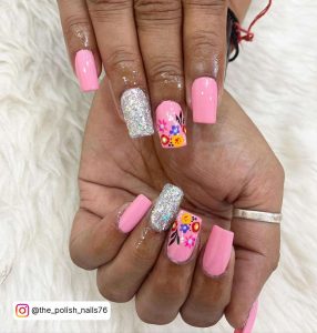 Barbie Pink Square Tip Nails With One Flower Design And One Silver Glitter Nail