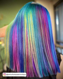 Bright Blue, Periwinkle, Lilac, Pink And Yelllow Streaks In Long Straight Hair
