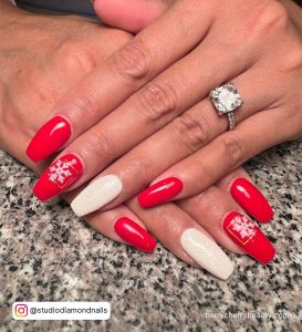 Christmas Red And White Glitter Nails With Snowflakes Design In Marble Surface