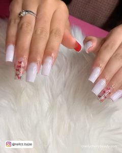 Coffin White Nails With Red Glitter Nails On Fur Clothe