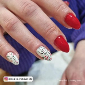 Flowery Almond Red, Black, And White Nails With Flowery Design And Person In Purple Sweater In The Background