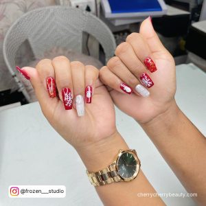 Gel Red And White Nails For Christmas With Snowflakes Design On Chair And Table Background