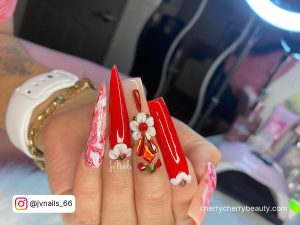 Hot Red And White Coffin And Stiletto Nails With Flower Base And Red Rhinestones With Salon Background