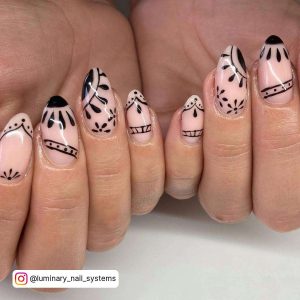 Light Pink Oval Nails With Black Henna Designs