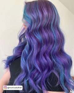 Long And Wavy Purple Hair With Blue Streaks