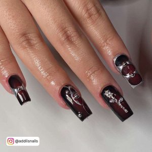 Long Brown Nails With Silver Chrome Designs