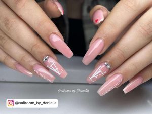 Long Pink Designer Nails With Silver Rhinestones On Cuticles