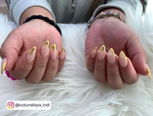 Nude Oval Nails With Gold Chrome French Tip Drip Effect