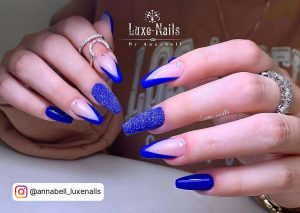 Royal Blue Ballerina Nails With V-Shaped Royal Blue French Tips And Glitter Nails