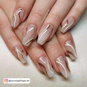 Short Nude Ballerina Nails With White, Brown And Gold Glitter Swirl Designs
