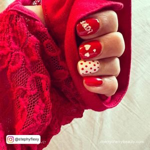 Valentine Red And White Gel Nails With Polka Dots, And Love Art Popping From Red Sweater