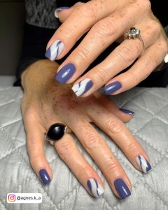 Abstract Blue And White Gel Nails On Grey Surface
