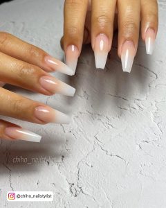Adorable Coffin White And Nude Ombre Nails Over White Cracked Surface