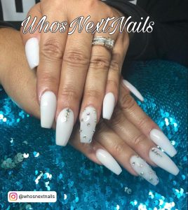 All White Nails With Diamonds On A Sparkly Pillow