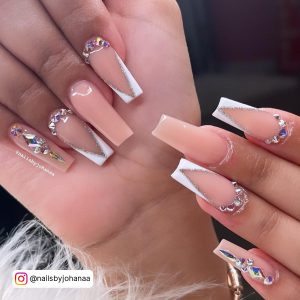 Baddie French Tip White Acrylic Nails With Diamonds And Glitter Over White Fur