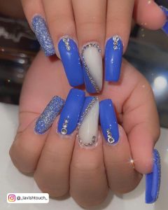 Bling Blue And White Coffin Nails With Rhinestones And Glitter Over White Surface