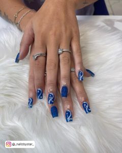 Blue Nails With White Glitter Design