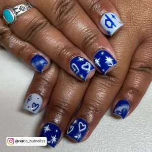 Blue Nails With White Hearts For A Sparkly Effect