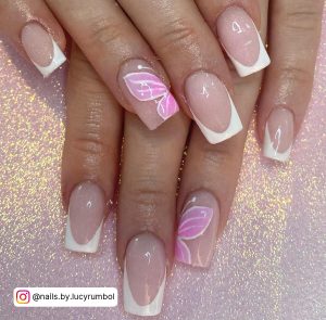 Butterfly Pink And White Acrylic Nails With French Tips Over Glittery White Surface