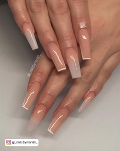 Chic Nude And Ombre Coffin Nails With Frenchies Over White Surface