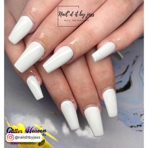 Chic White Acrylic Coffin Nails On White Surface