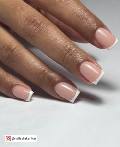Classy Short White French Tip Nails On White Surface
