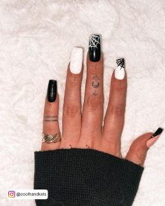 Coffin Black White Glitter Nails With Glittery Spiderweb Design And French Tip Laying On Fur Clothe