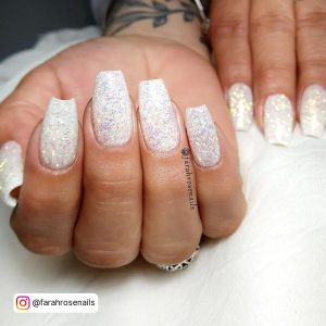 Coffin White Glitter Nails Placed Over White Pillow