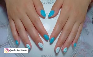 Cute Blue And White Nails With Heart And Polka Dot Design On Polish Dryer
