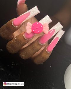 Cute Pink Nails With White Gliiter Tips And A Bow Stud