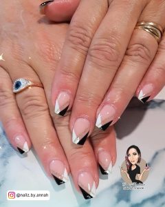 Cute White And Black French Tip Nails With Glitter On Marble Surface
