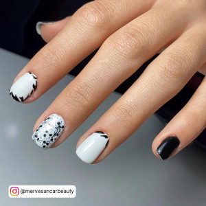 Easy Black And White Nail Art For Short Nails With Black Glitter, Reverese French Tips, And Plain Black Nails.