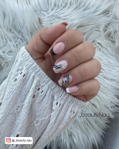 Elegant Black And White Nails Design With French Tips And Tiger Prints On Fur Clothe