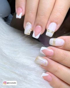 Elegant Gel Nails With White Tips And Designs Over White Fur
