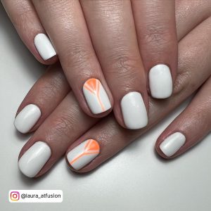 Elegant Orange And White Short Gel Nails On White Surface
