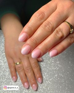 Elegant White To Pink Ombre Nails Over Glittery Surface