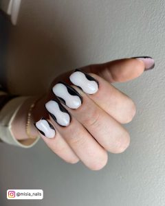 Euphoria Black And White Nails Over Grey Surface