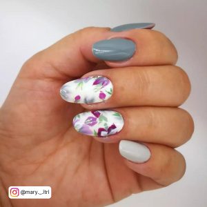 Flowery Grey And Off White Gel Nails Over White Surfaces