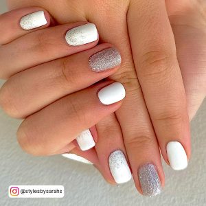 Glittery White And Silver Gel Nail Ideas On White Surface